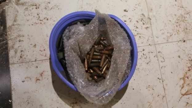 Bullet casings are seen in a helmet on the floor of the Radisson hotel in Bamako (20 November 2015)