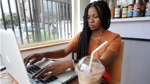 A woman uses a computer in Lagos, Nigeria