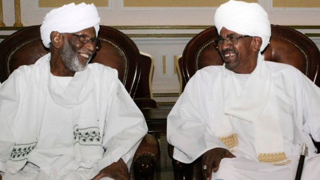 Hassan al-Turabi (left) with President Omar al-Bashir in Khartoum, 14 March 2014