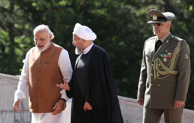 Indian Prime Minister Narendra Modi, left, walks with Iranian President Hassan Rouhani during a welcoming ceremony at the Saadabad Palace in Tehran, Iran, Monday, May 23, 2016.