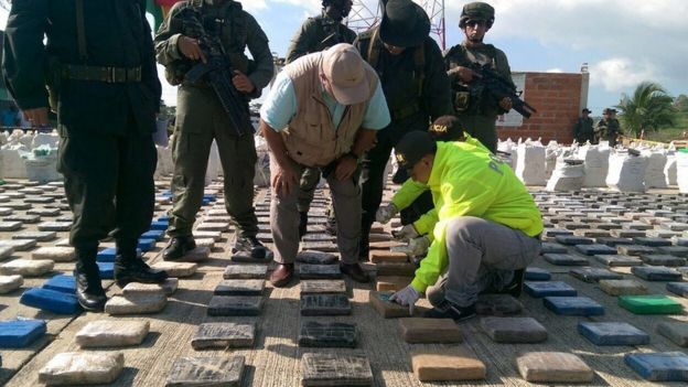 Colombian police inspect confiscated packages of cocaine in Turbo, Colombia, 15 May 2016
