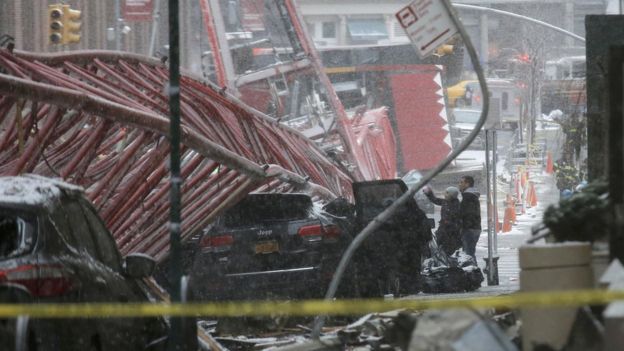 Emergency crews survey the collapsed crane