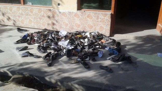 The abandoned shoes of Afghan schoolgirls involved in a deadly stampede are seen outside a school following an earthquake in Takhar Province (October 26, 2015)