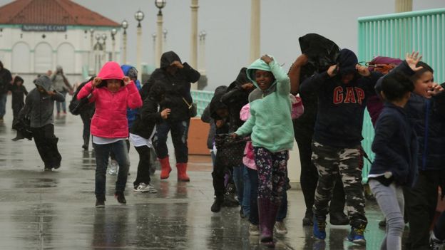 Schoolchildren caught in heavy rain in Los Angeles, California, on 17 February 2017