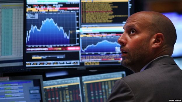 A trader works on the floor of the New York Stock Exchange (NYSE) on 24 August 2015 in New York City.