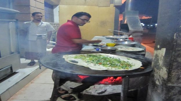 A Yemeni chef preparing a dish.