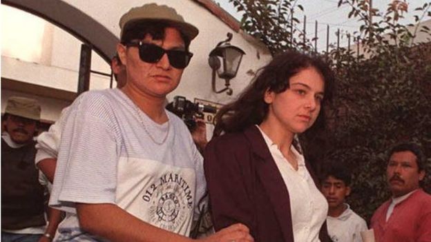 Lori Berenson and of the US is escorted 15 December by a police woman