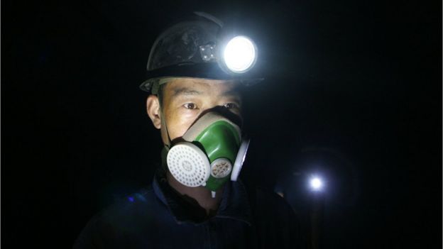 File image of a Chinese miner with a face mask on