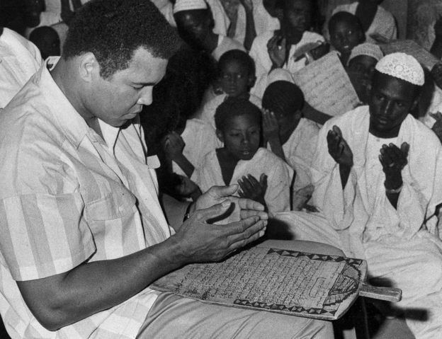 Former world heavyweight boxing champ Muhammad Ali prays with a class of Muslim boys at Dafaalah el Sa'em Mosque in Khartoum, Sudan - November 1988