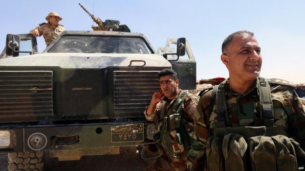 Iraqi Kurdish Peshmerga fighters near the Iraqi town of Sinjar