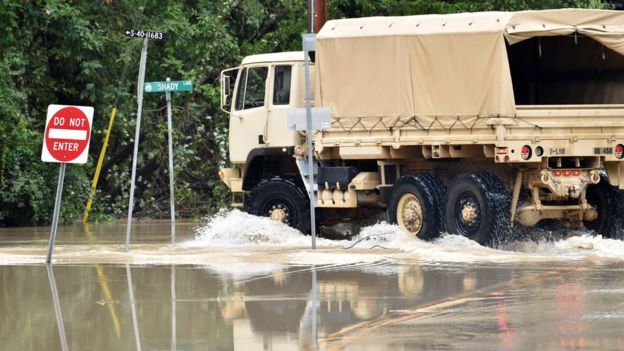 A National Guard truck drives in Columbia, South Carolina on 5 October 2015.