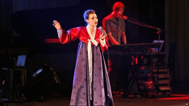 A member of Slovenian rock band Laibach wears a traditional Korean dress as she performs in Pyongyang, North Korea, Wednesday, Aug. 19, 2015.