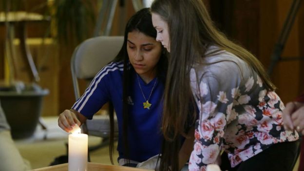 Rachel Marsh, 15, right, and Selena Orozco, 15, left, light candles at prayer service, Sept. 24, 2016, at the Central United Methodist Church in Sedro-Woolley, Washington