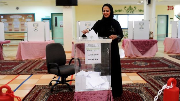 A Saudi woman casts her ballot in the coastal city of Jeddah