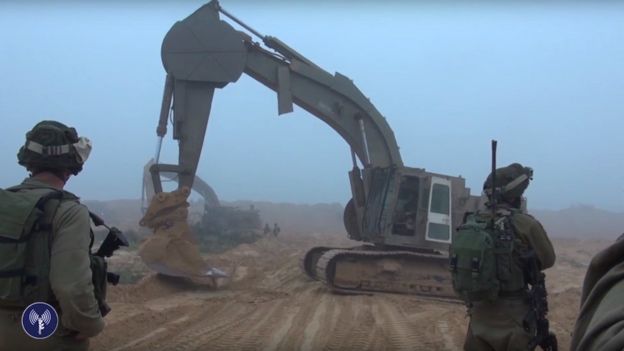 Screen grab of video released by Israel Defense Forces showing digger above tunnel f-rom Gaza discovered inside Israeli territory (18 April 2016)