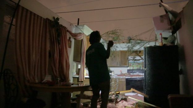 Enoch Kinard looks through his destroyed house at 1604 Ellerslie Ave., Tuesday, Feb. 23, 2016 in LaPlace, La.