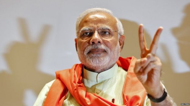 Narendra Modi gestures upon his arrival to meet his party leaders and workers at Gandhinagar in the western Indian state of Gujarat in this May 13, 2014 file photo.