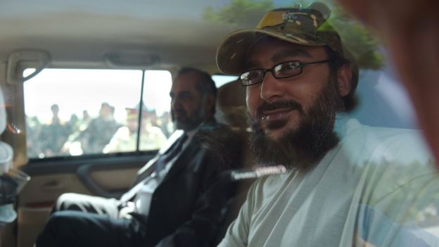 The son of former Pakistani prime minister Yousaf Raza Gilani, Ali Haider Gilani (R), looks on as he travels with Pakistani Ambassador to Afghanistan Syed Abrar Hussain in a vehicle at the Ministry of Defence in Kabul on May 11, 2016.