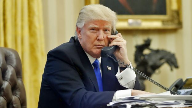 President Trump on the phone in the Oval Office of the White House - 28 January 2017