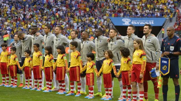 France's squad listen to their national anthem before the match between France and Nigeria at the Mane Garrincha National Stadium in Brasilia during the 2014 FIFA World Cup on June