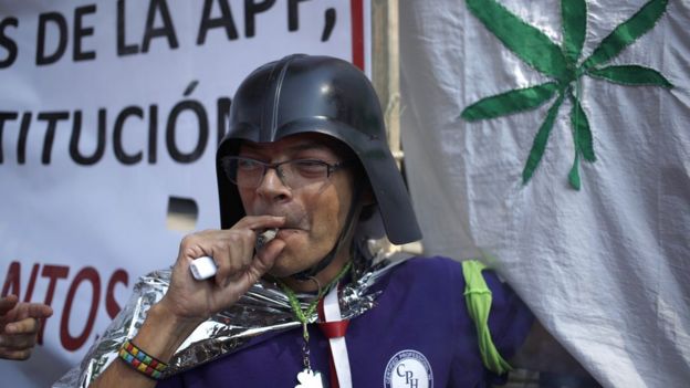Marijuana supporter smokes outside of the Supreme Court in Mexico