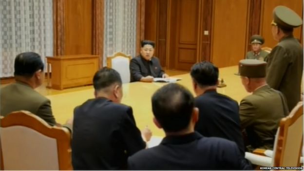 Screen grabs of Kim Jong-un attending the emergency expanded meeting of central military commission on the night of 20 August 2015.