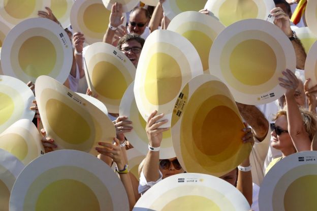 Demonstrators in Barcelona hold placards symbolising heartbeats, 11 September