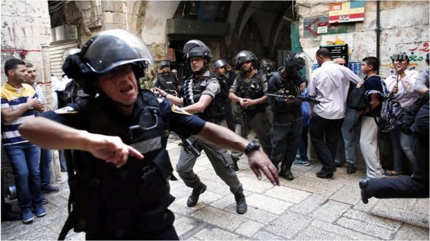 Israeli police use stun grenades as they start to disperse Palestinian demonstrators in Jerusalem's Old City