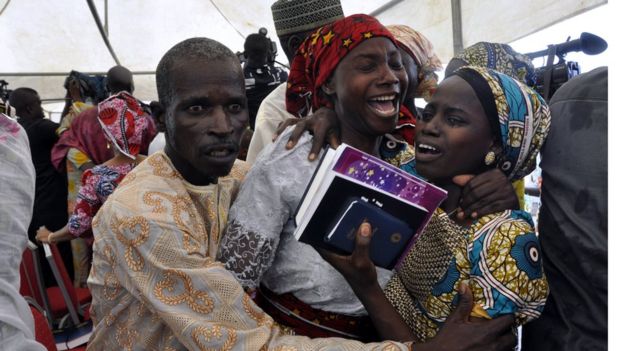 A Chibok girl celebrates with family members during an church service held in Abuja, Nigeria - Sunday 16 October 2016