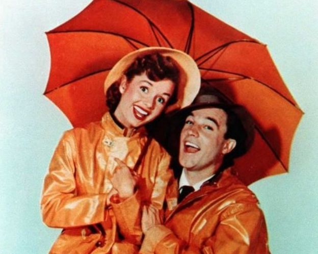 This undated file photo shows US actor Gene Kelly, who died 02 February at the age of 83 at his home in Beverly Hills, California, with actress Debbie Reynolds from the movie 