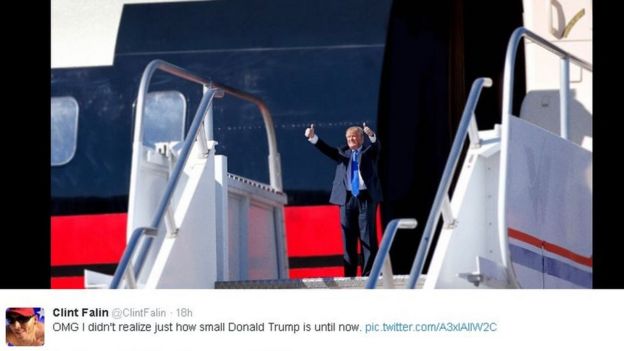 A doctored, small Trump on the steps of an airplane, with thumbs held aloft. Twitter user @ClintFalin tweets: OMG I didn't realize just how small Donald Trump is until now.