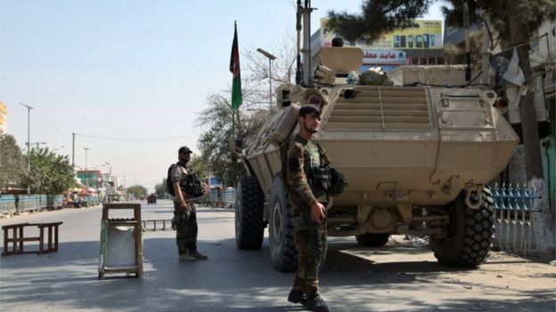 Members of the Afghan security forces stand guard at a check point on a roadside in Kunduz, Afghanistan, 07 October 2015.