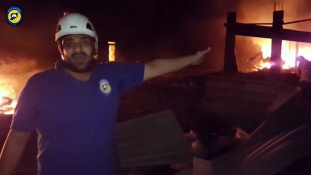 In this grab taken from video provided by the Syrian Civil Defence White Helmets, a member of the team describes the damage after an airstrike, in Aleppo, Syria, on 19 September