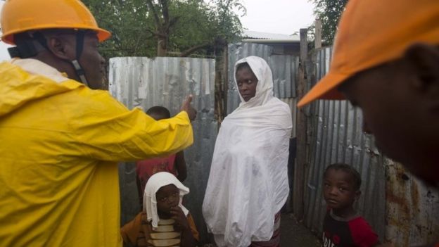 Civil protection workers ask residents to evacuate their homes in Haiti