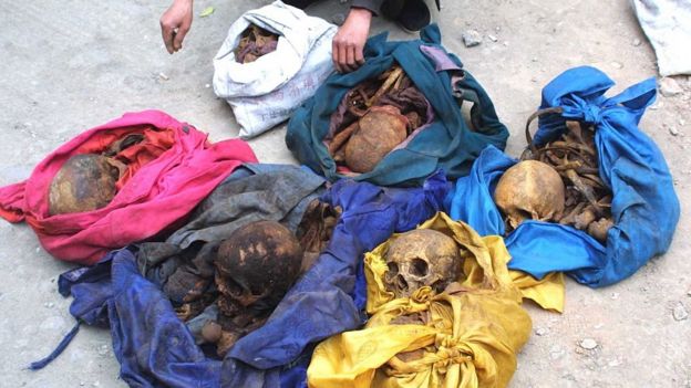 The image shows Yang Jinyu, a peasant from Xinghuo Village who stolen six skeletons of adult female to sell for ghost marriage is caught by police on March 28, 2005 in Xi'an