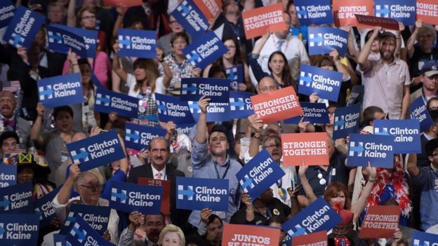 Delegates hold posters as Vice presidential nominee Tim Kaine addressed the Democratic convention.