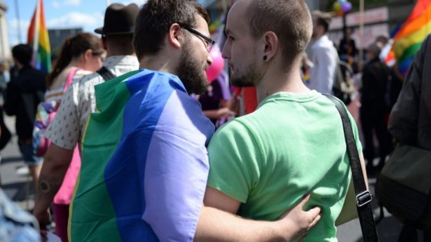 Participants embrace during the annual Gay Pride Parade in Warsaw, Poland, 11 June 2016.