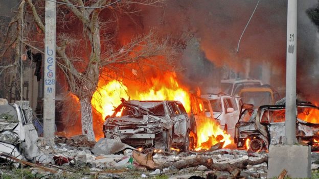 Wrecked cars burn at the scene of a terror attack at the Ambassador Hotel, Mogadishu, Somalia - Wednesday 1 June 2016