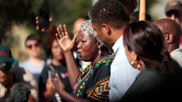 Agnes Hasam, a family friend of the Alfred Olango, speaks to protesters gathered at the El Cajon Police Department headquarters to protest fatal shooting of an unarmed black man Tuesday by officers in El Cajon, California, U.S. September 28, 2016.