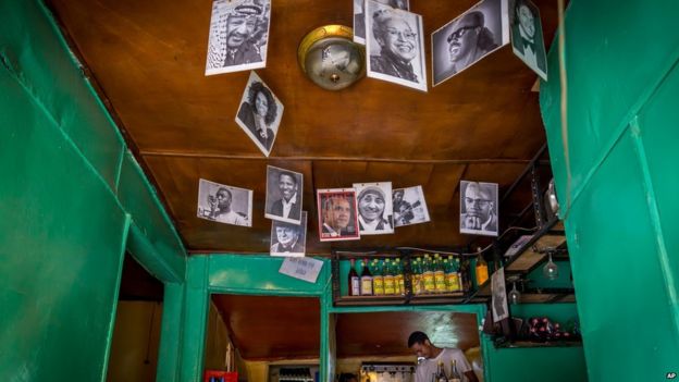 In this photo taken Saturday June 20, 2015, a portrait of U.S. President Barak Obama is displayed with other famous people in the National Cafe in Addis Ababa, Ethiopia. Barack Obama, the United States’ first African-American president, has captured the imagination of people across the continent where his face shows up on billboards, backpacks, T-shirts and restaurants