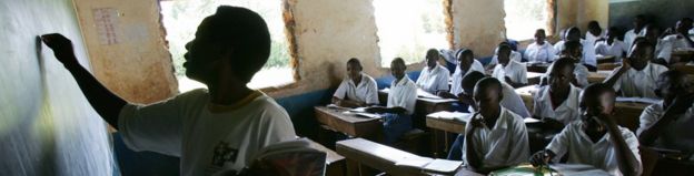 A teacher writes on a blackboard during a class at the Bar Sauri elementary school in eastern Kenya 22 March 2007