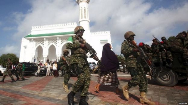 Soldiers serving in the African Union Mission in Somalia (AMISOM) patrol outside a mosque during Eid al-Fitr prayers 17/07/2015