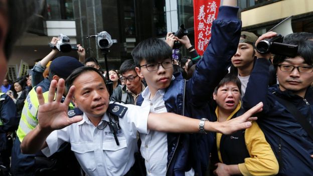 Pro-democracy activist Joshua Wong (centre) at protests on election day in Hong Kong