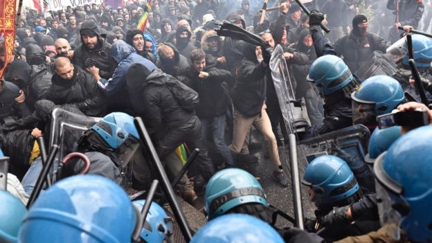 Demonstrators clash with police during a protest against Prime Minister Matteo Renzi, in Florence