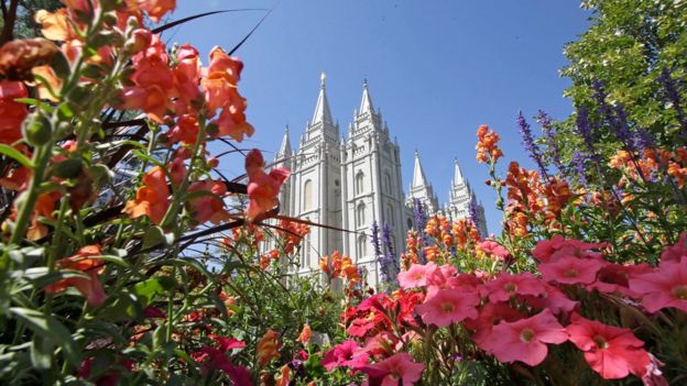 This Aug. 4, 2015,,file photo, flowers bloom in front of the Salt Lake Temple, at Temple Square, in Salt Lake City.