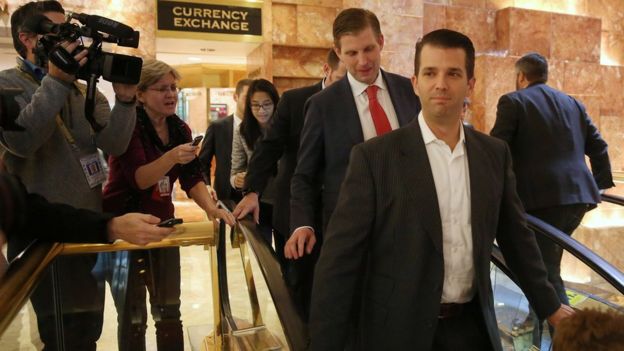 Sons Eric Trump (L) and Donald Trump Jr go down escalators outside offices of Republican president-elect Donald Trump at Trump Tower in New York, New York, U.S. November 14, 2016