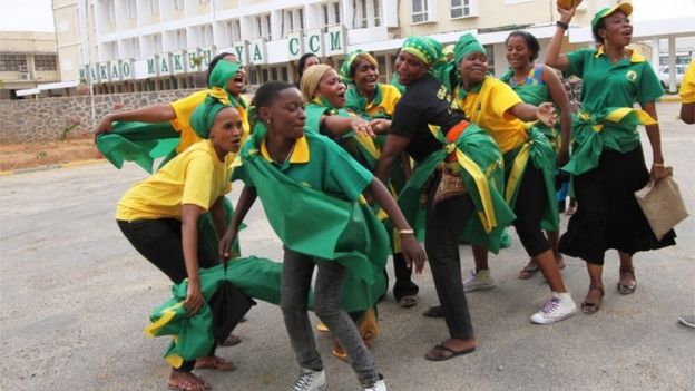 Supporters of the ruling CCM party celebrates at the party's headquarters in Dodoma, Tanzania, after the party’s presidential candidate, Dr. John Pombe Magufuli was declared a winner, Thursday Oct. 29, 2015