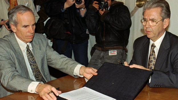 In this July 7, 1997, file photo, American millionaire Douglas Tompkins, left, and Juan Villarzu, chief of staff of the Chilean president, hold the text of an accord signed in Santiago, Chile.