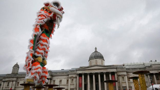 Participants perform the Dance of the Lion as they take part in an event to celebrate the Chinese Lunar New Year of the Rooster