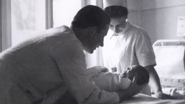 Claus Knapp with a baby in Hamburg